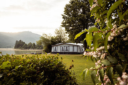 Large camping tent on the lakeshore at the Paradiescamping Wolfgangsee campsite
