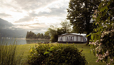 Large camping tent on the lakeshore at the Paradiescamping Wolfgangsee campsite